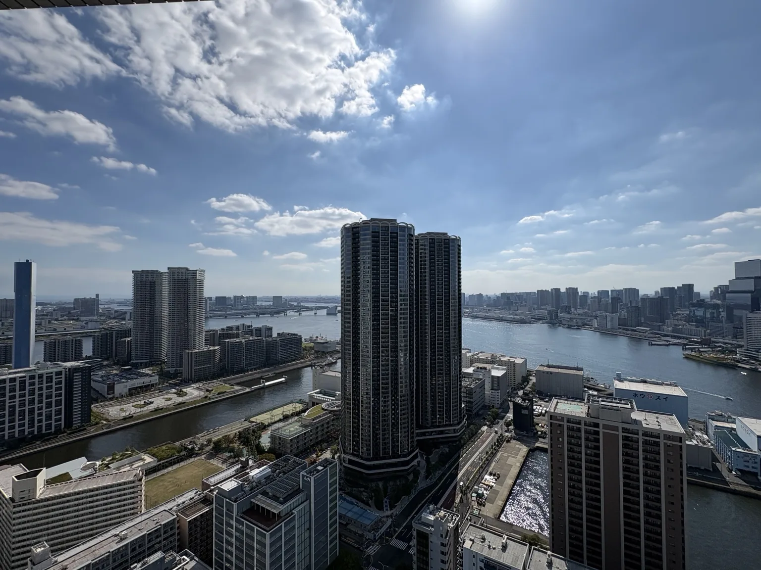 Waterfront view toward the THE TOYOMI TOWER MARINE&SKY towers across the water