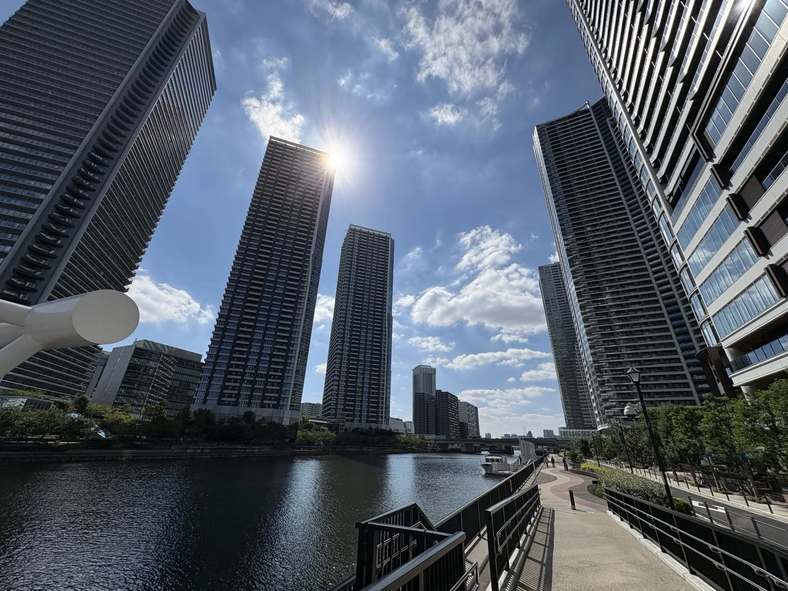 Canal-side promenade in Kachidoki with the Deux Tours towers to the west