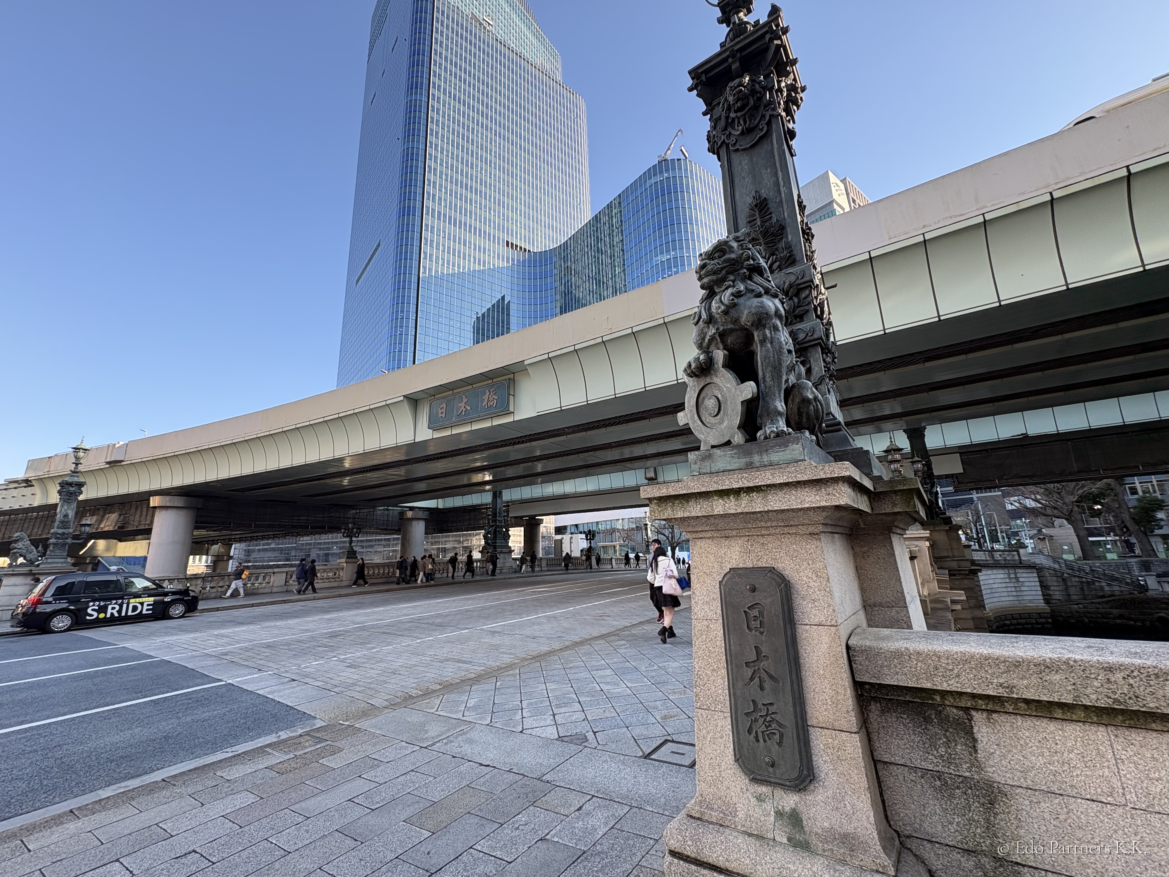 Nihonbashi Bridge with its lion statue, the elevated Shuto Expressway visible overhead