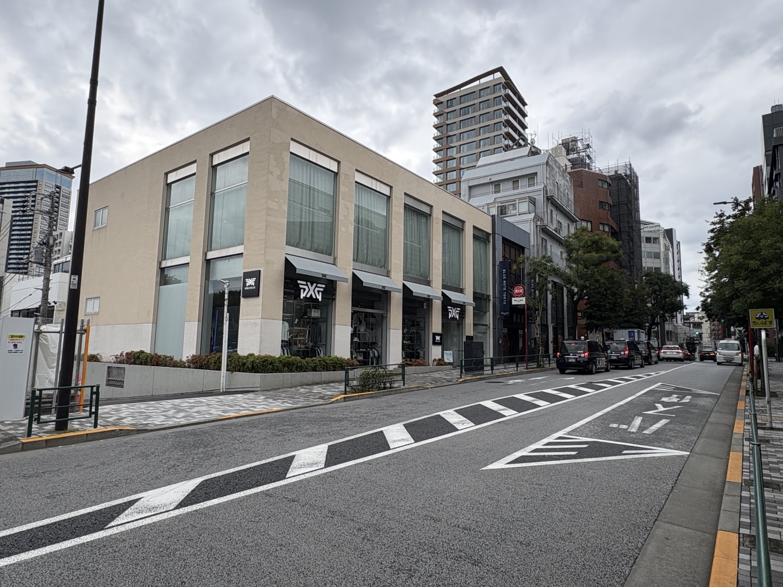 Minami-Aoyama street with the Blue Note Tokyo sign beside a low-rise storefront