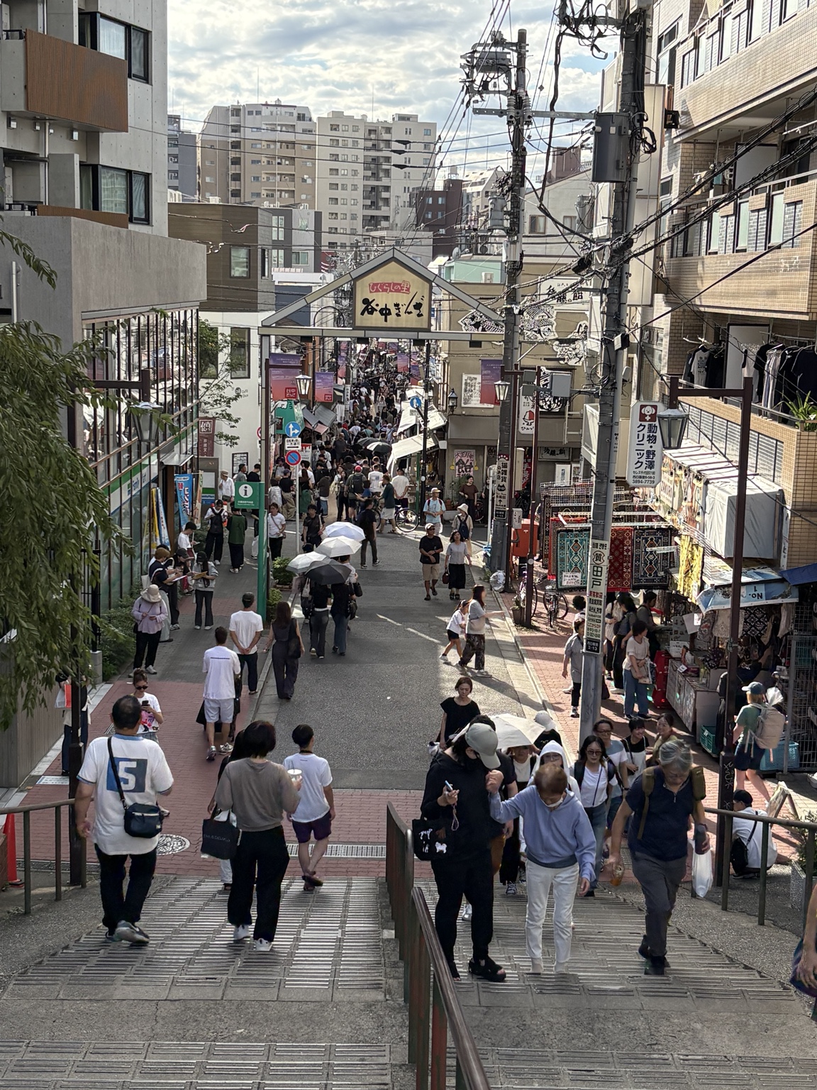 View down the steps toward Yanaka Ginza shopping street